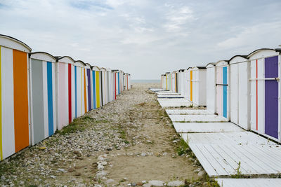 View of beach huts against sky