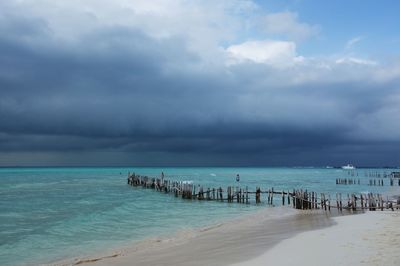 View of calm sea against cloudy sky