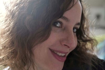 Close-up portrait of a smiling young woman