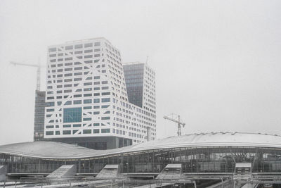 Modern buildings against clear sky in city