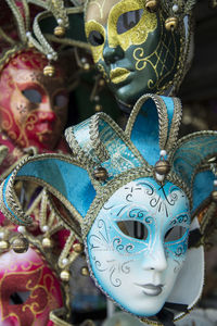 Close-up of carnival masks for sale at store