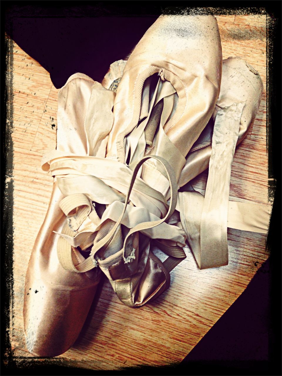 transfer print, auto post production filter, indoors, still life, close-up, high angle view, table, wood - material, old, no people, metal, stack, day, vignette, equipment, sunlight, old-fashioned, shoe, wood