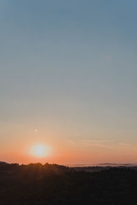 Scenic view of silhouette landscape against sky during sunset
