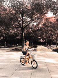Full length of girl sitting in park