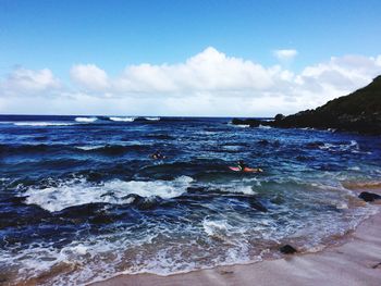 Scenic view of sea against cloudy sky