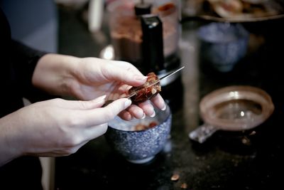 Close-up of person preparing food