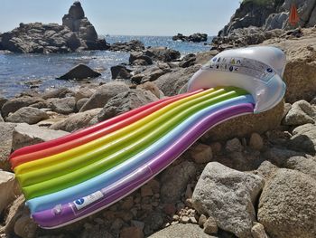 Close-up of multi colored rocks on shore