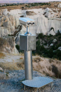 Close-up of wooden post on rocks