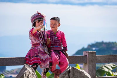 Low angle view of child against sky