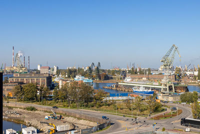 High angle view of city buildings against clear sky