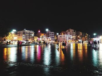 Illuminated buildings in city at night