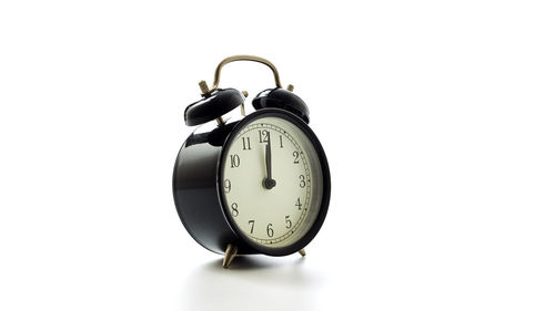Close-up of clock against white background