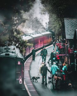 Group of people waiting for train in city