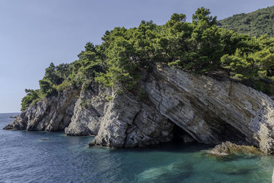 Petrovac, montenegro, august 11, 2024. coast landscape with rocks and vegetation.