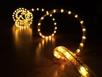 Close-up of illuminated lighting equipment on table