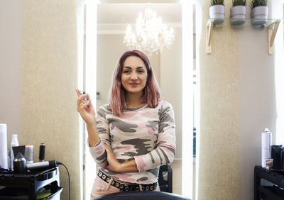 Portrait of woman smiling at home