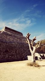 Low angle view of building against cloudy sky