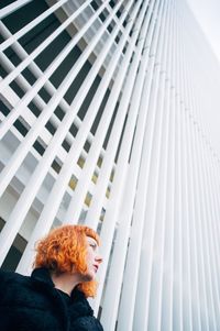Low angle view of woman looking away