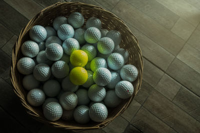 High angle view of balls in basket
