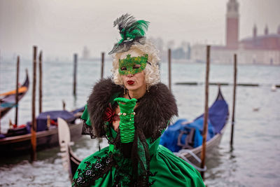 Portrait of woman standing in water