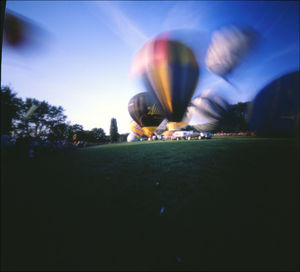 Multi colored lights against blue sky