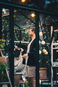 People standing in illuminated shopping mall