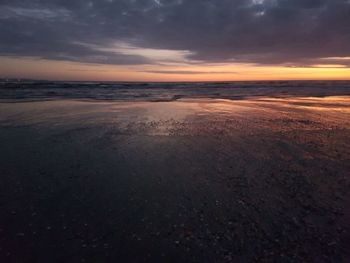 Scenic view of sea against sky at sunset