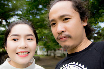 Portrait of young couple at park