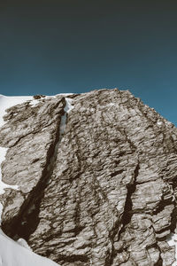 Low angle view of man against clear sky