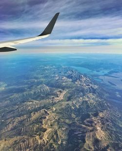 Aerial view of airplane flying over landscape