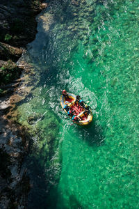 High angle view of people on boat in sea