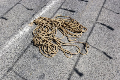 High angle view of ropes on sand