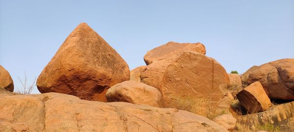 Panoramic view of rocks against clear sky