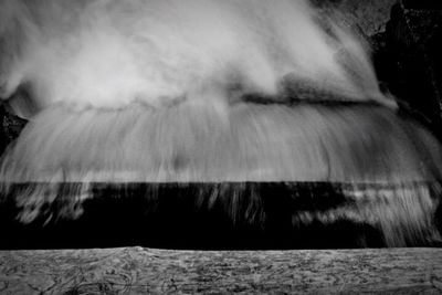 Close-up of waterfall against sky