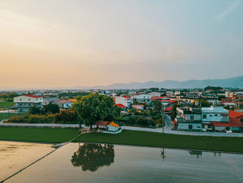 High angle view of townscape against sky during sunset