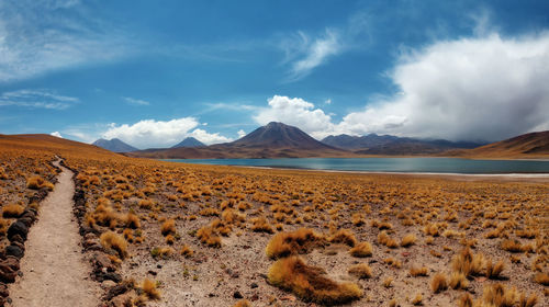 Scenic view of arid landscape against sky