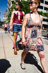 Young woman walking on street in city