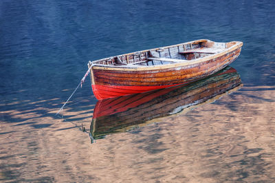 High angle view of abandoned boat moored on shore