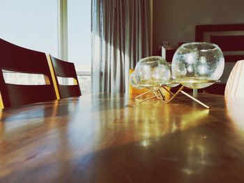 Glass containers on dining table at home