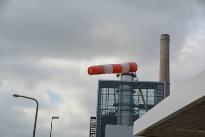 Low angle view of factory against sky