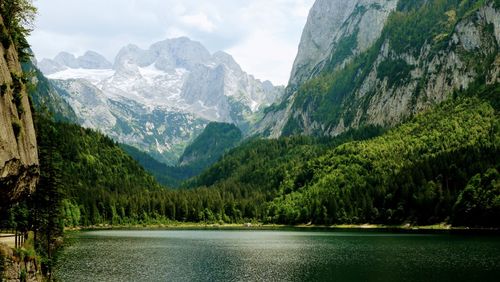 Scenic view of lake and mountains against sky