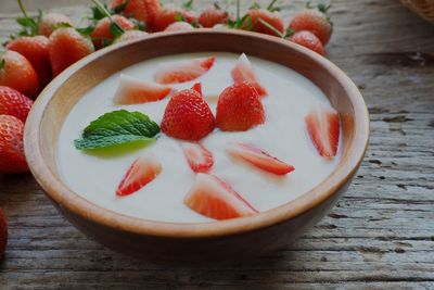 High angle view of chopped fruits in bowl on table