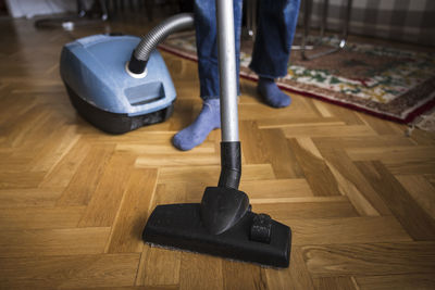 Woman vacuuming living room