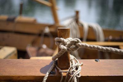 Close-up of rope tied to wood