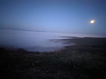 Scenic view of sea against sky at night