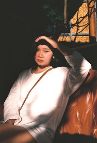 Portrait of young man sitting outdoors