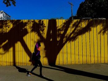 Woman walking on road