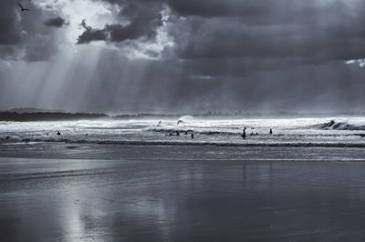 Scenic view of sea against cloudy sky