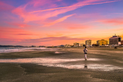 Jogging at the beach with sunset