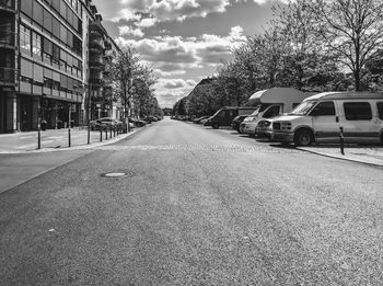 Surface level of road against sky in city